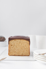 Vanilla pound cake loaf with a dark chocolate glaze topping
