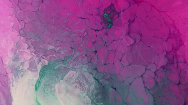 Color Flow From Top to Bottom. abstract backdrop. Beautiful metallic green, pink, blue texture paint close-up. Liquid slow motion Art. Colorful Chaos Turbulence. 