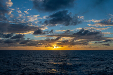 Beautiful seascape - waves and sky with clouds with beautiful lighting. Golden hour. Sunset at sea.
