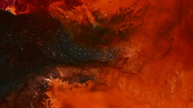 Flowing glitter waving surface. Flowing Golden abstract backdrop. Beautiful metallic texture paint close-up. Liquid slow motion Art. Colorful Chaos Turbulence. 