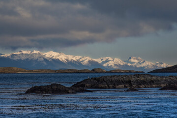 Panoramic shot of ushuaian Andes snowed mountains called End Of The World and in the front a little...