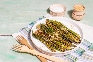 Ripe grilled asparagus. Golden flax seeds, healthy and wholesome food concept