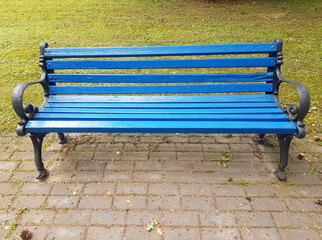 A blue wooden bench in close-up. Park bench for recreation
