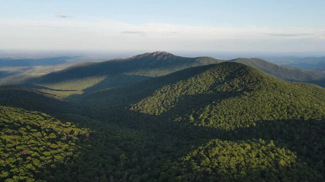 Scenic aerial overview of Shenandoah mountains and hills from above during summer sunset