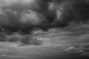 Obraz premium Epic Dramatic Storm sky, dark grey rainy clouds with wind, abstract background texture, thunderstorm. Black and white photo 