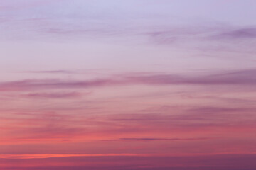 Sunrise, sunset purple pink violet blue sky with clouds abstract background texture, copyspace
