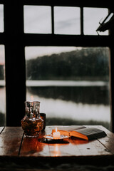 cup of coffee, book and candle on table