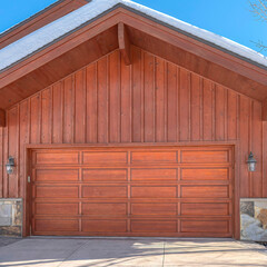 Square Home facade in Park City Utah with view of the front door and attached garage