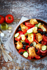 Panzanella salad with bread, olives and tomatoes.