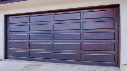 Pano Brown wood panel door of attached garage in San Diego California neighborhood