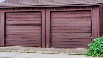 Pano Detached two car garage of home in San Diego California with sky background