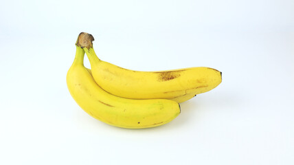 fresh bananas of the Cavendish variety on a white background