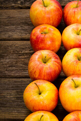 apple fruits in a row, old weathered wood table background