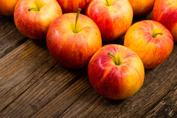apple fruits in a row, old weathered wood table background