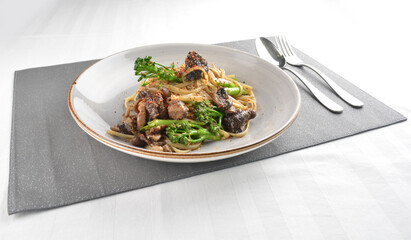 fried olive oil vegetarian mushroom with vegetable pasta in alio olio style western halal menu