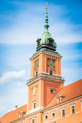 Fototapeta premium Close view of the Clock tower of The Royal Castle in the old town city center of Warsaw, Poland.