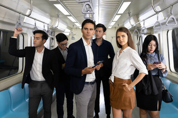 portrait group of business people in subway train