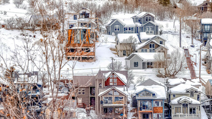 Pano Neighborhood in the slopes of snow covered mountain on a winter landscape
