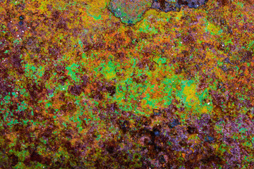 Beautiful green, orange, purple and yellow metal surface texture background
