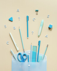 Back to school creative concept. Open envelope and school supplies