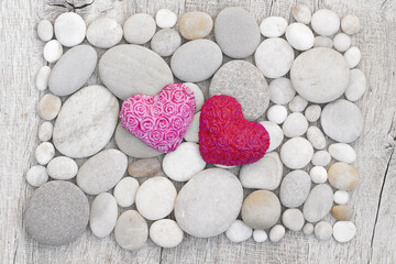 Obraz premium Pink Hearts On White Pebble