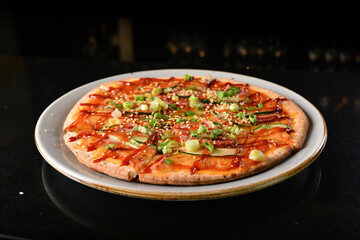 baked cheesy pizza with bbq sauce chicken and duck meat in white background western halal menu