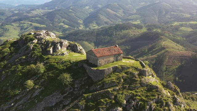 Aerial drone view of the hermitage of Santa Eufemia on the top of a mountain in Aulestia in the Basque Country
