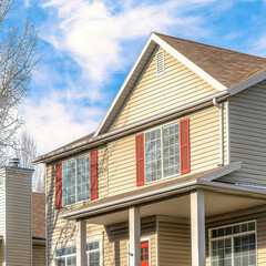 Square Neighborhood scenery with homes featuring porches overlooking the yards and road