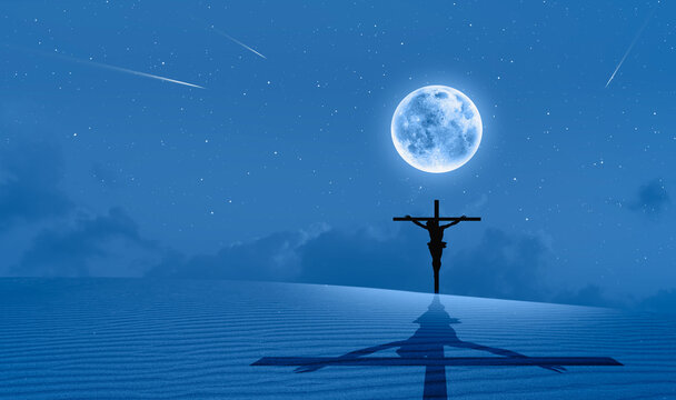 Jesus on the cross top of the sandune with full moon -"Elements of this image furnished by NASA"