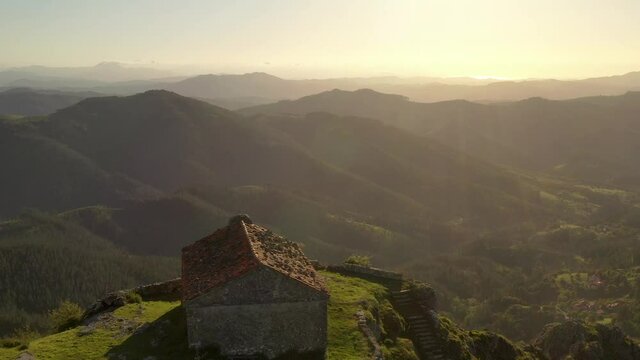 Aerial drone view of the hermitage of Santa Eufemia on the top of a mountain in Aulestia in the Basque Country