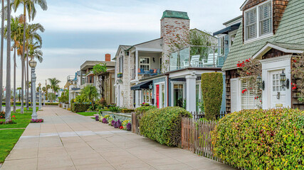Pano Exterior of charming homes in Long Beach California on palm tree lined streets