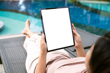 focus on female hand holding digital tablet white screen device