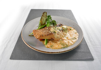 pan fried bbq fresh cod, salmon, grouper fish fillet in chef sauce with potato, corn and vegetables western halal menu