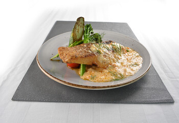 pan fried bbq fresh cod, salmon, grouper fish fillet in chef sauce with potato, corn and vegetables western halal menu