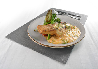 pan fried bbq fresh cod, salmon, grouper fish fillet in chef sauce with potato, corn and vegetables western halal menu