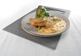 pan fried bbq fresh cod, salmon, grouper fish fillet in chef sauce with potato, corn and vegetables western halal menu