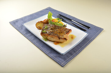 pan fried bbq fresh cod, salmon, grouper fish fillet in chef sauce with potato, corn and vegetables western halal menu