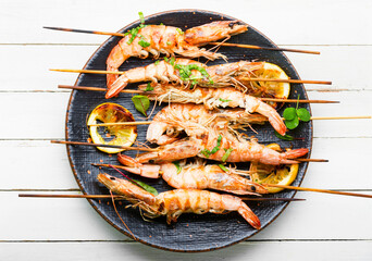 Langoustines or prawns on a skewer,white background