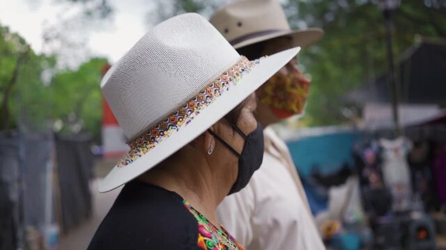 grandparent couple walking in the streets of oaxaca