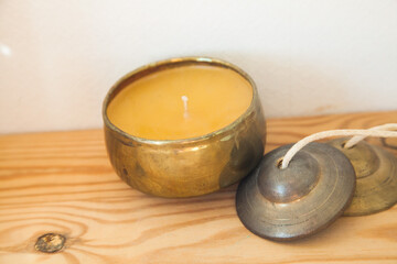 I put Tingsha on a wooden table.