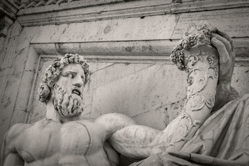 Statue of Tiberinus in front of the Palazzo Senatorio (Senatorial Palace)  at the Piazza del Campidoglio in Rome, Italy