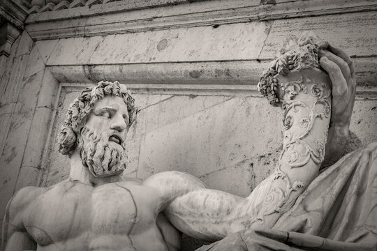 Statue of Tiberinus in front of the Palazzo Senatorio (Senatorial Palace)  at the Piazza del Campidoglio in Rome, Italy