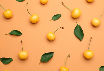 Tasty sweet cherries on color background