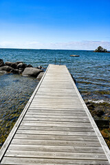 Fototapeta premium jetty with bathing ladder in lake Vattern Sweden