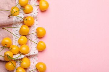 Tasty sweet cherries on color background