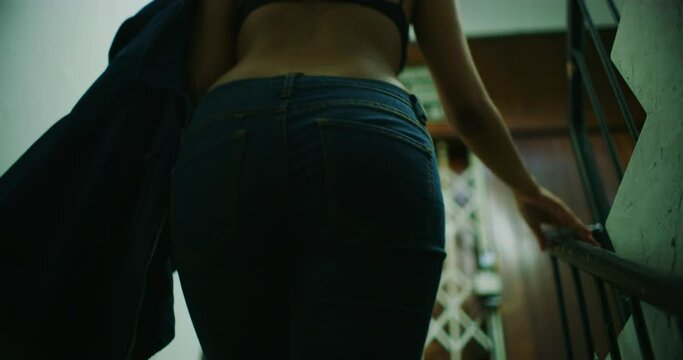 Slow Motion Tracking Shot of a Woman Walking Up Stairs in Kuala Lumpur, Malaysia