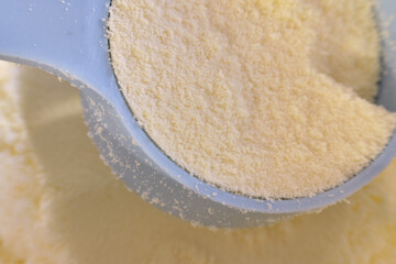 Formula for feeding a newborn baby as a substitute for milk, close-up macro photo