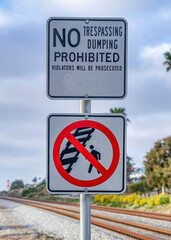 Vertical No Walking on Railway sign and No Trespassing and Dumping sign in San Diego CA