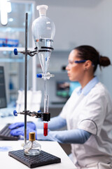 Specialist pharmacist woman typing bacteriology infection test results on computer analyzing pharmaceutical medical expertise in hospital laboratory, Biologist doctor working at medicine experiment