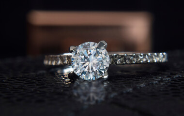 The wedding ring is white gold decorated with diamonds.